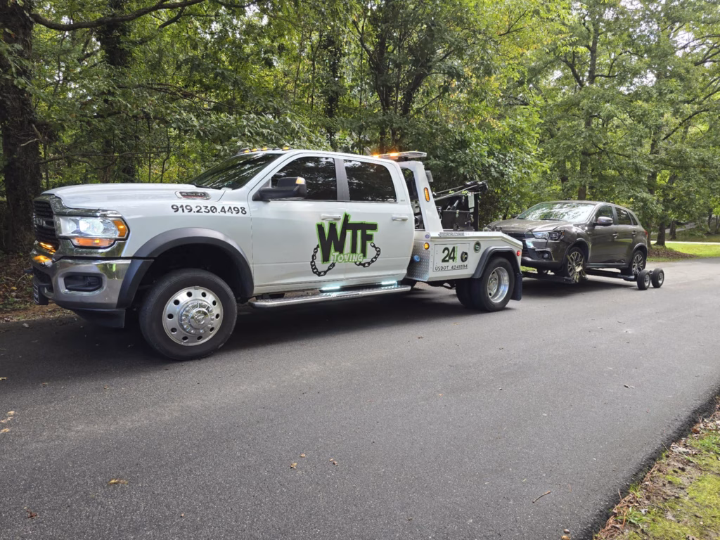 WTF Towing Ram wrecker hooked up to a pickup truck in Cary, NC