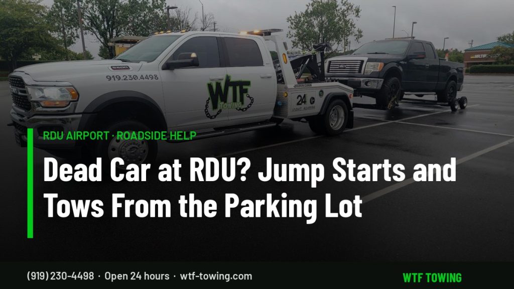 WTF Towing Ram wrecker hooking up a pickup in a parking lot — RDU Airport towing, jump starts and roadside help near Cary, NC