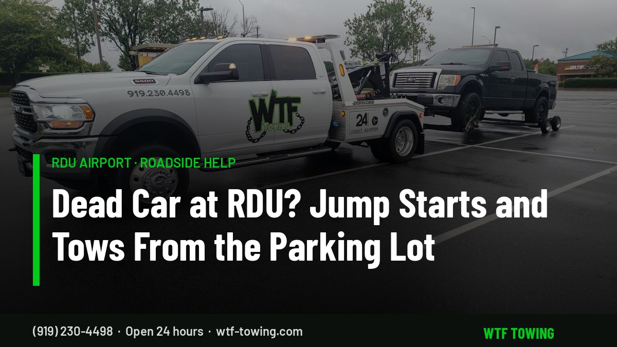 WTF Towing Ram wrecker hooking up a pickup in a parking lot — RDU Airport towing, jump starts and roadside help near Cary, NC