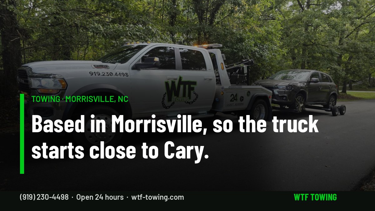 WTF Towing wrecker towing an SUV on a tree-lined road — towing in Morrisville, NC, based close to Cary, RTP and RDU