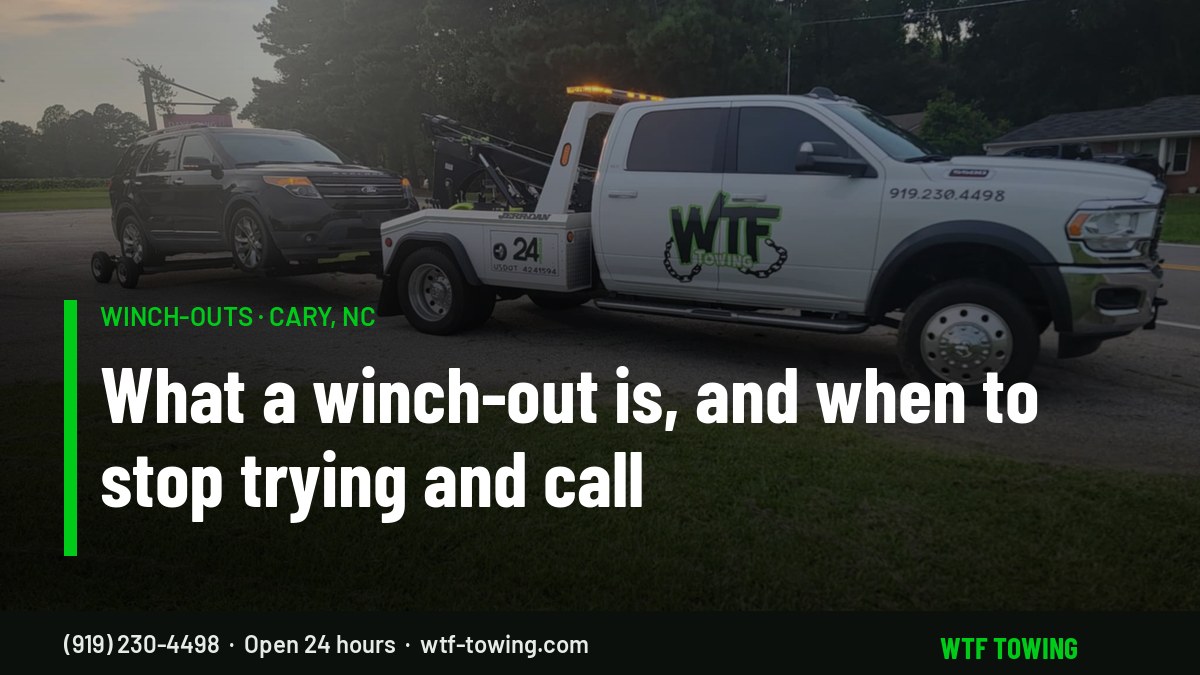 WTF Towing wrecker with a vehicle in tow — winch-out service in Cary, NC