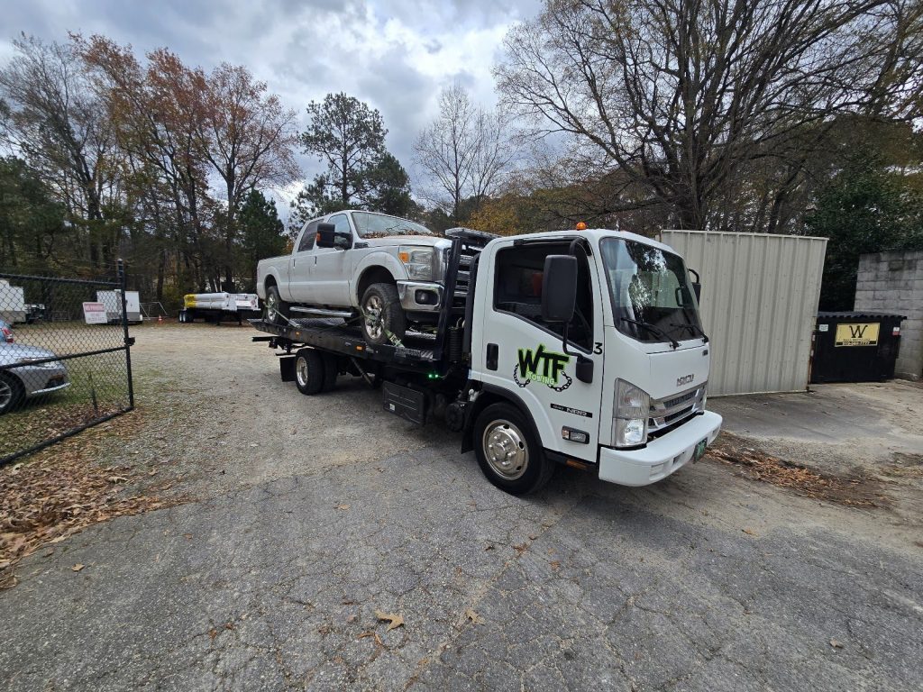 WTF Towing rollback with a Ford F-250 loaded, Cary, NC